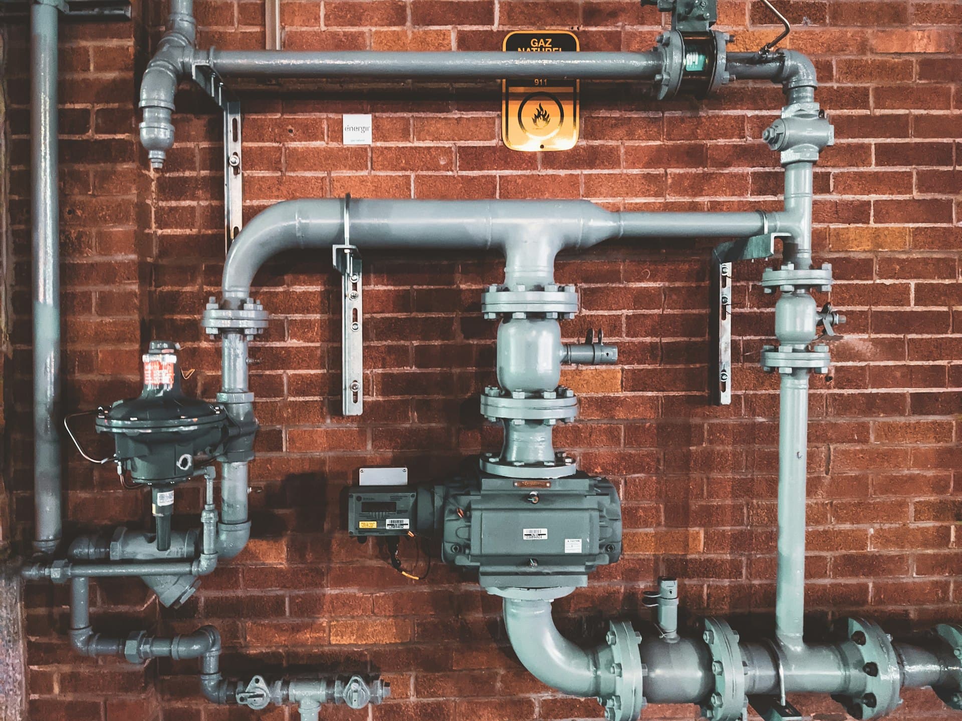 Gas Safe registered heating engineer working on plumbing pipework in South London